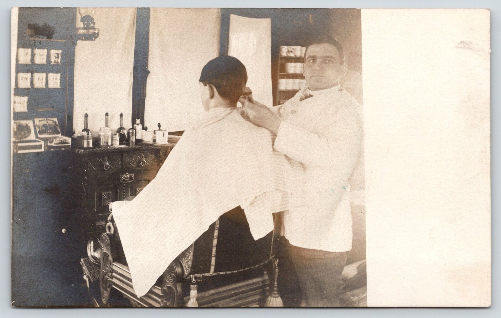 Real Photo Postcard~Vintage Barber Shop Interior~Boy Gets Hair Cut~c1905 RPPC