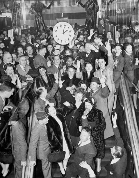 Joyful crowd points to clock as the Zanzibar night club closes und .. Old Photo