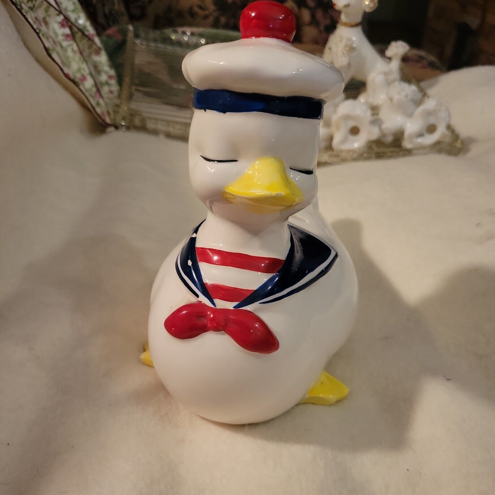 EMPRESS BY HARUTA HANDPAINTED SAILOR DUCK BANK. MISSING SOME PAINT.