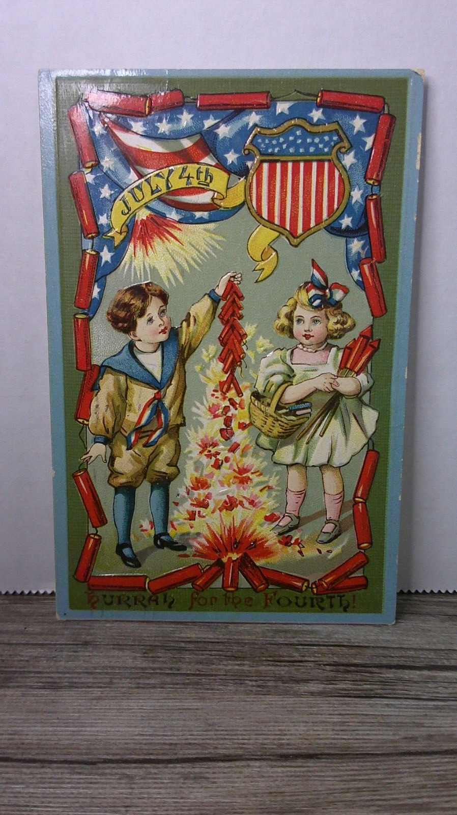 antique postcard July 4th boy & girl lighting firecrackers hurray for 4th     2N