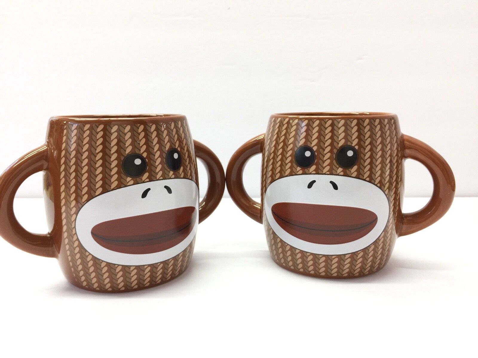 2 Sock Monkey Coffee Mug Cup Double Handles Ceramic Brown 4 inches Tall Galerie 