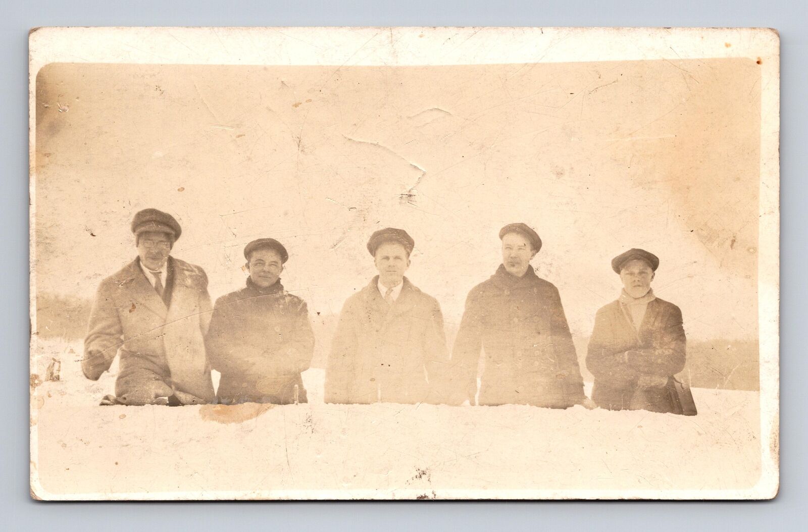 c1904-1918 RPPC Postcard Five Men in the Snow Cal a Kee Co? Hats Flat Caps
