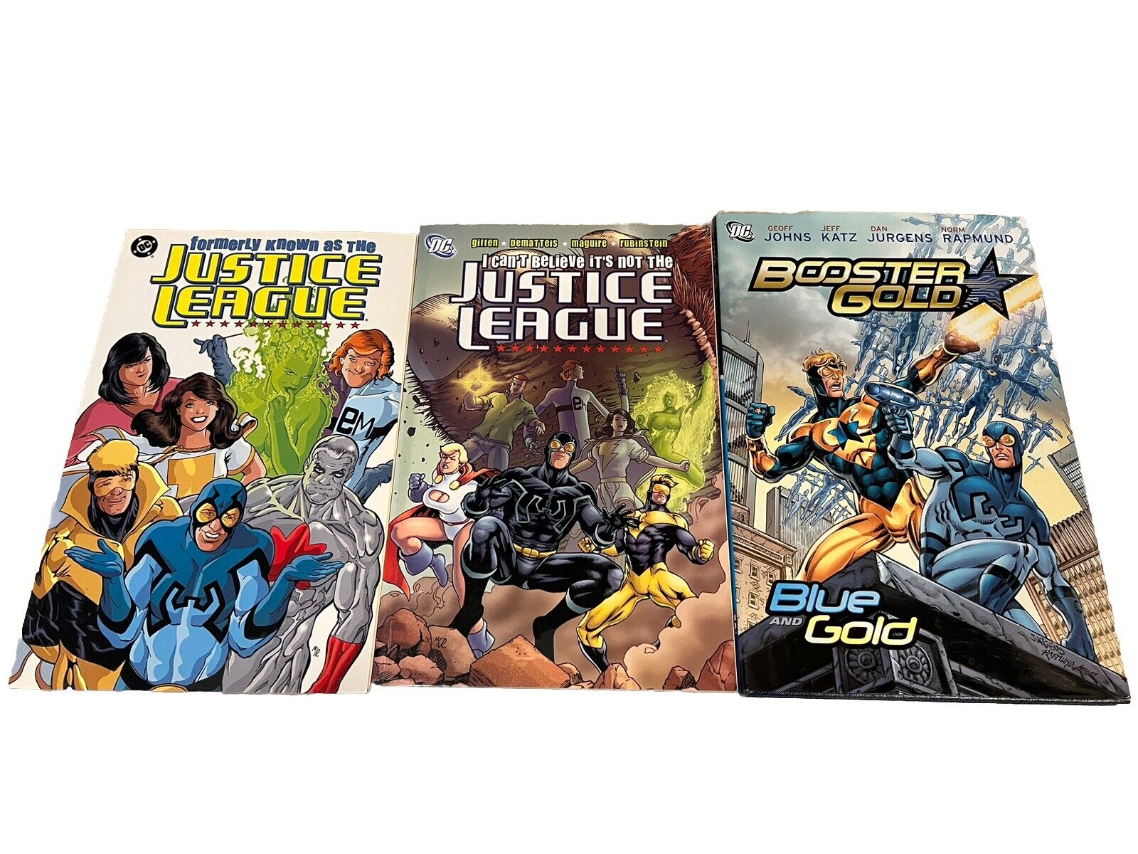 justice league international tpb & Booster Gold Hardcover Lot