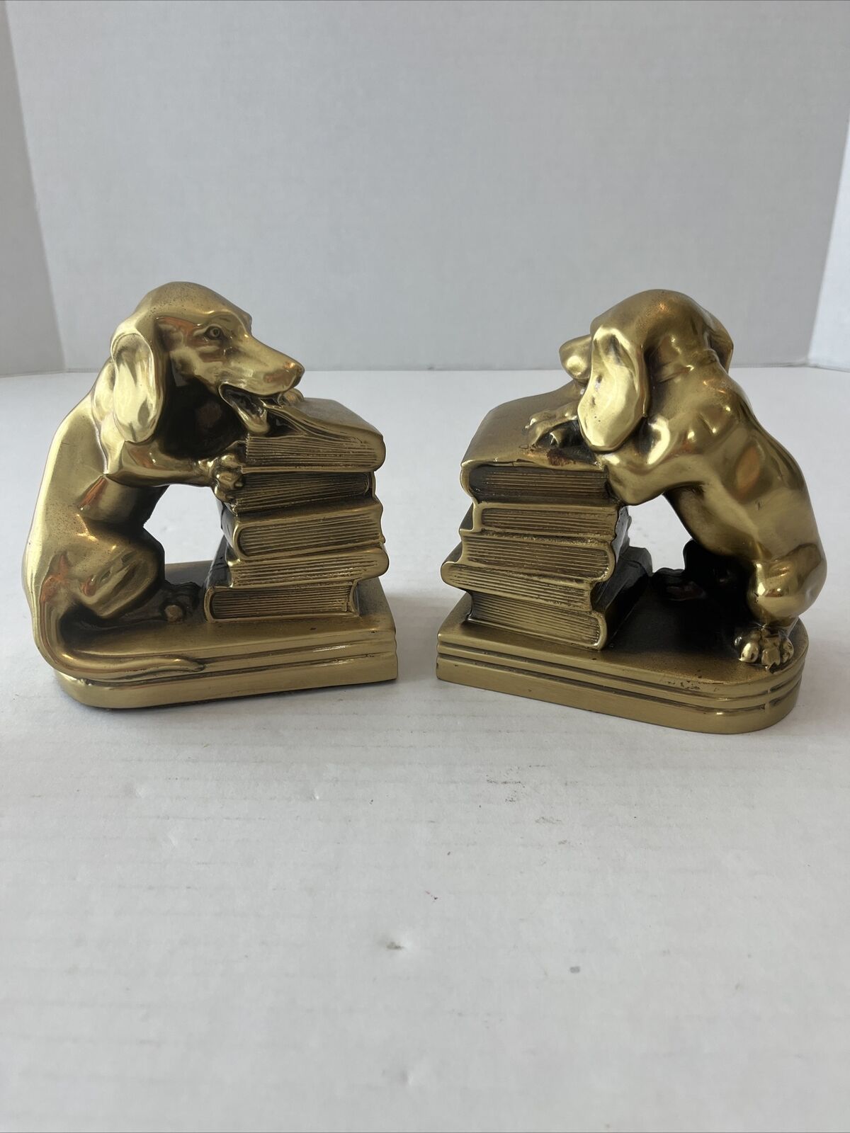 A PAIR OF VINTAGE DOG  BRONZE / CAST BOOKENDS VERY GOOD CONDITION WEIGHS 5 LB.
