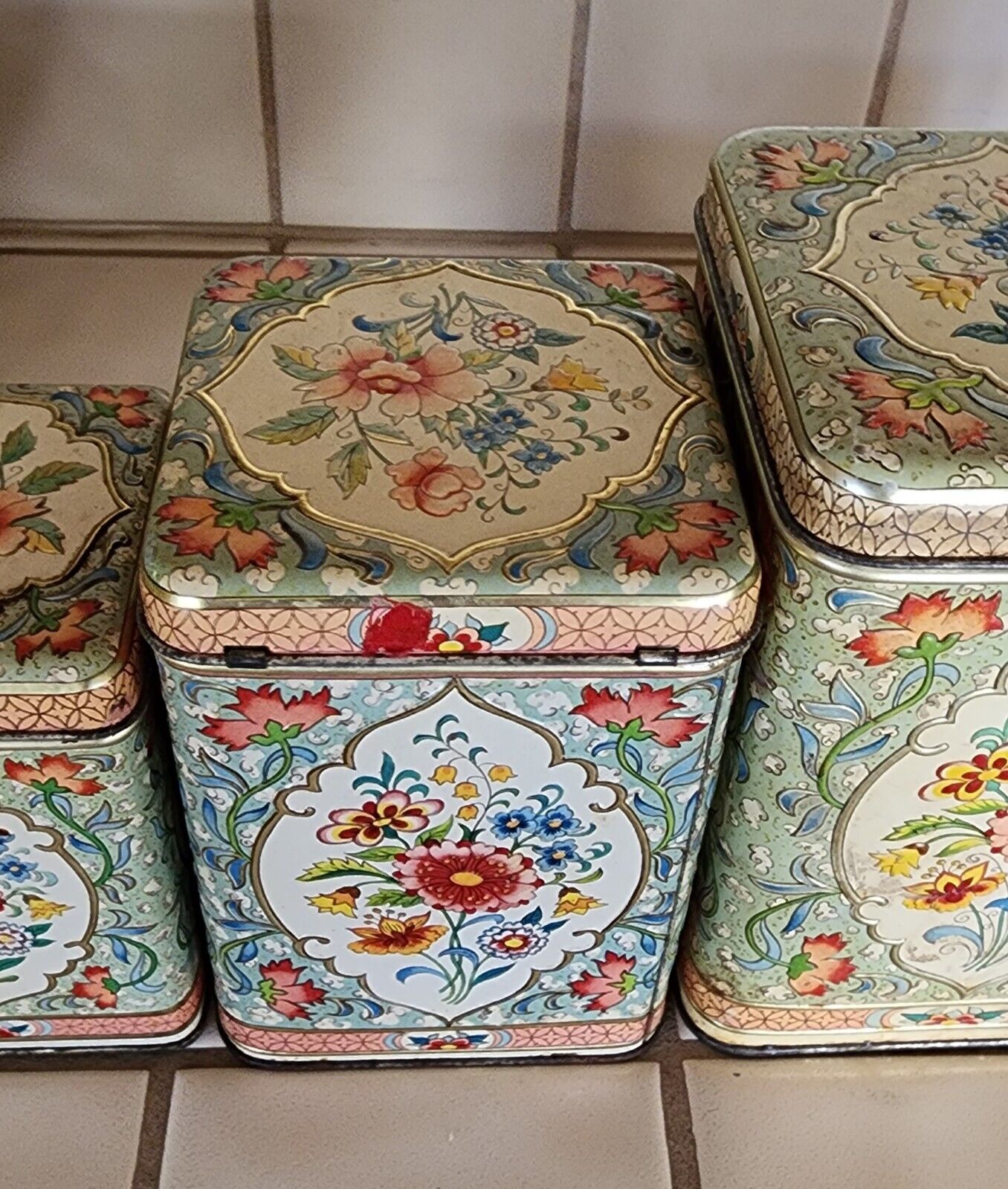 SET 4 CANISTERS, antique Flora embossed painted tins, Holland.  VERY GOOD