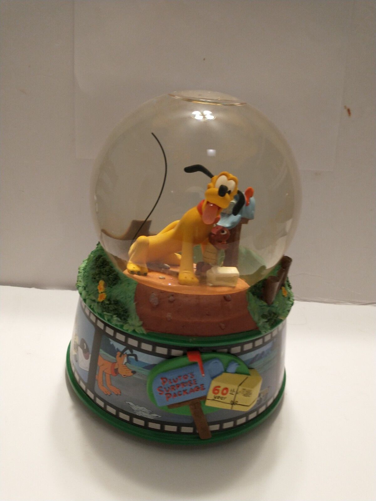 Disney's Pluto's Surprise Package 60th Year Waterglobe.In Mint Condition. Rare.