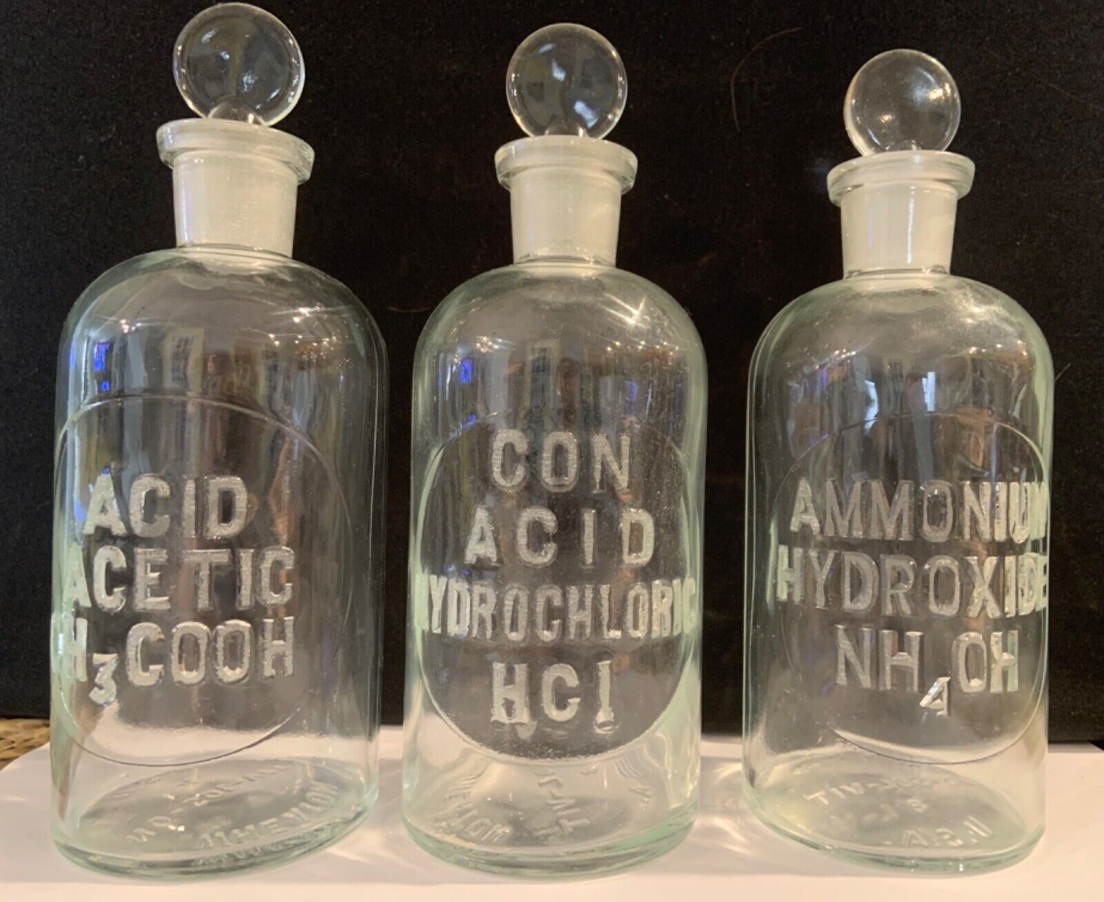 Three Embossed Apothecary Chemical Bottles