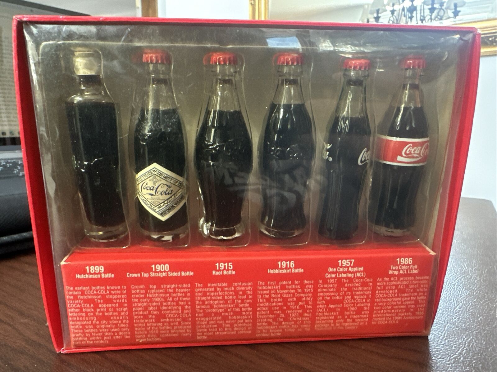 Evolution of the Coco Cola Contour Bottle - Minor Box Wear - Bottles Unopened