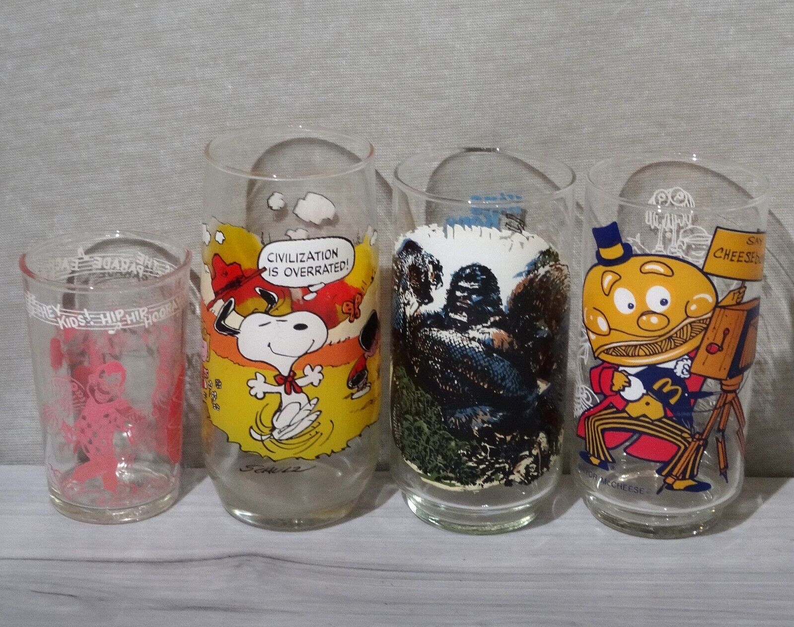 4pc Vintage Pop Culture Themed Drinking Glasses from 1953, 1971, 1976, & 1977