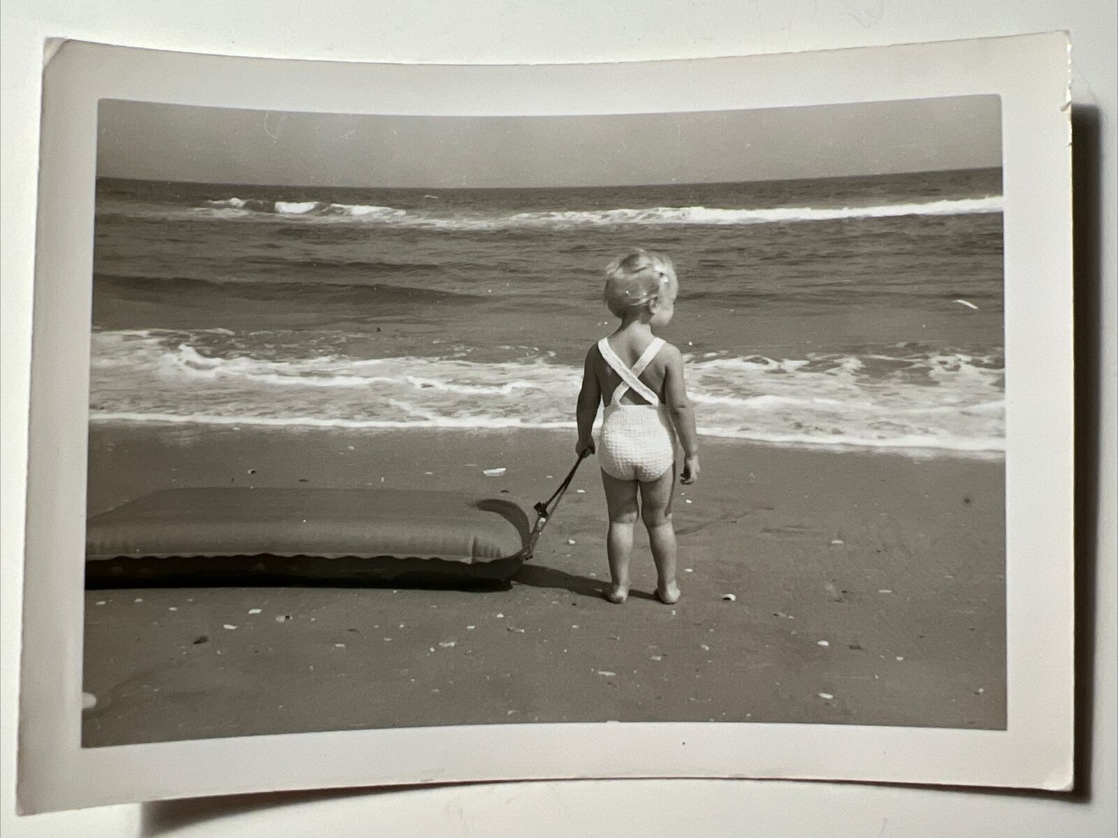 1960s Little Blonde BEACH Girl pulling RAFT Ocean Waves vintage Snapshot Photo