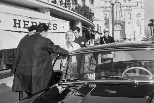 Marlene Dietrich gets into a taxi in front of a Hermes boutiqu- 1963 Old Photo 1