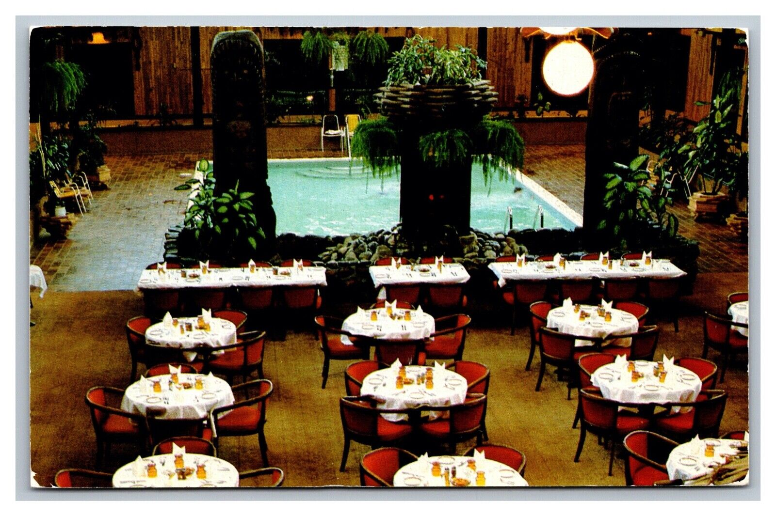 Fort Nelson, BC Canada, Alaska Highway Tiki Courtyard Hotel Postcard Posted 1989