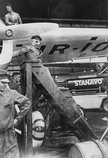 American aviator Wiley Post climbing out of an aircraft  OLD PHOTO
