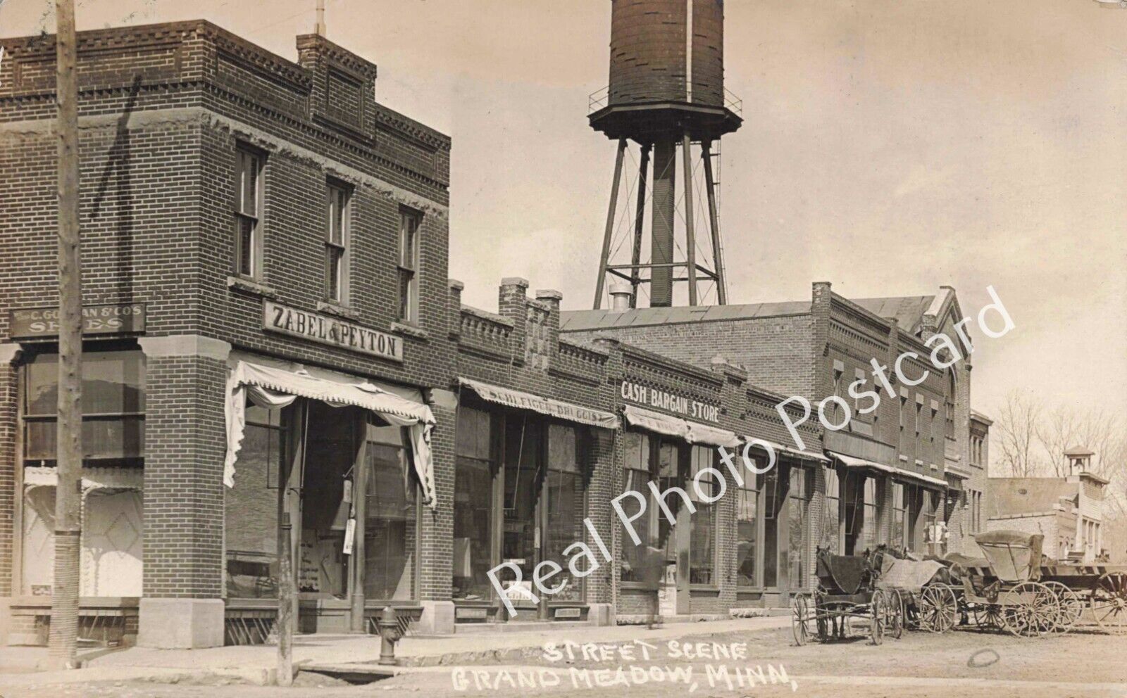RPPC Grand Meadow Minnesota Zabel & Peyton, Schleiger Drugs Vintage Postcard