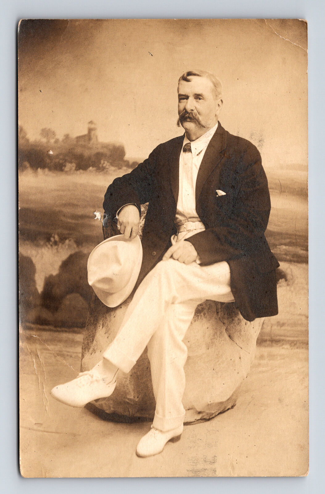 RPPC Studio Portrait of Finely Dressed Man in Suit White Hat Lighthouse Postcard