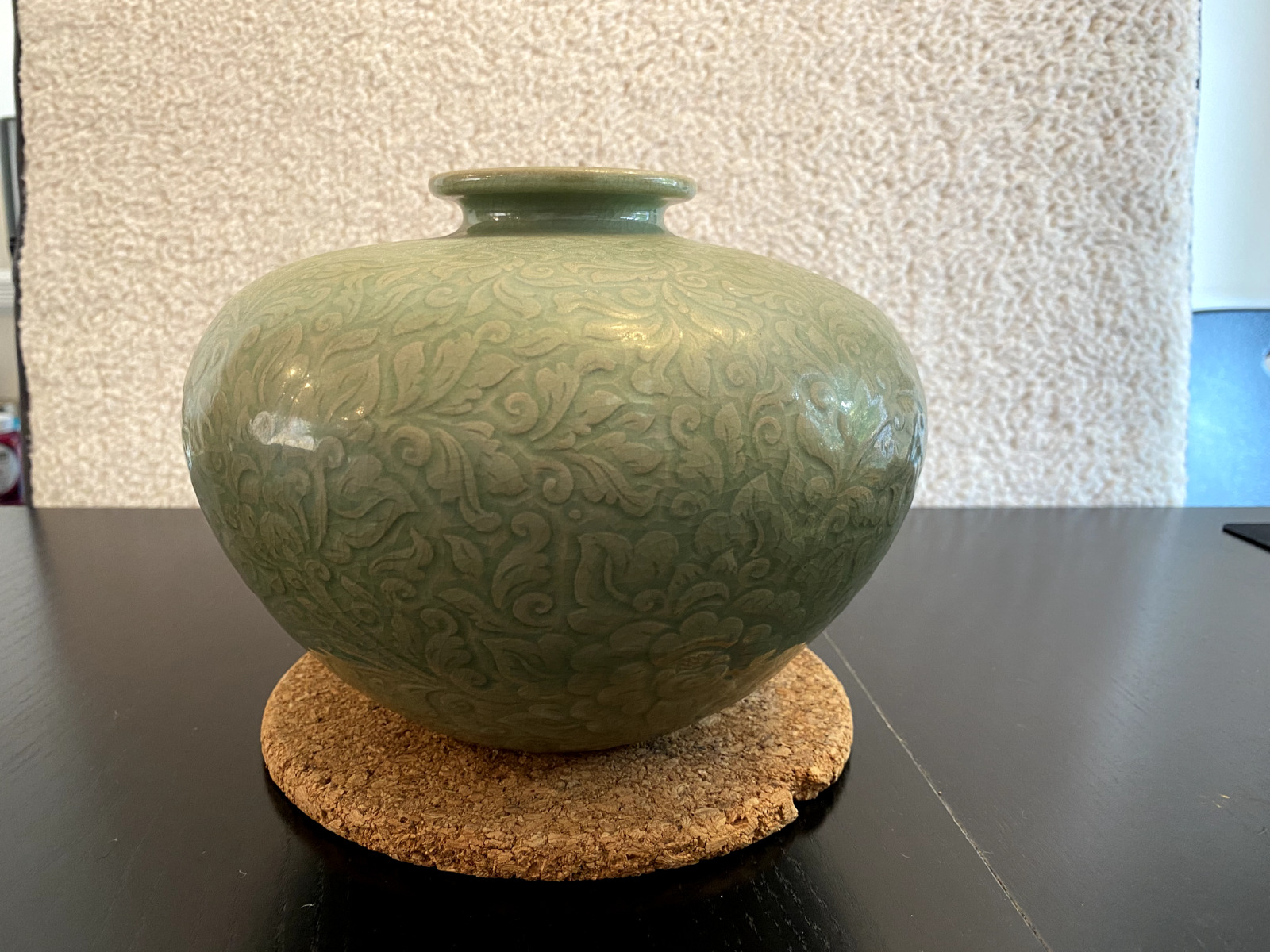 A Chinese Yaozhou-ware celadon porcelain jar carved with flowers