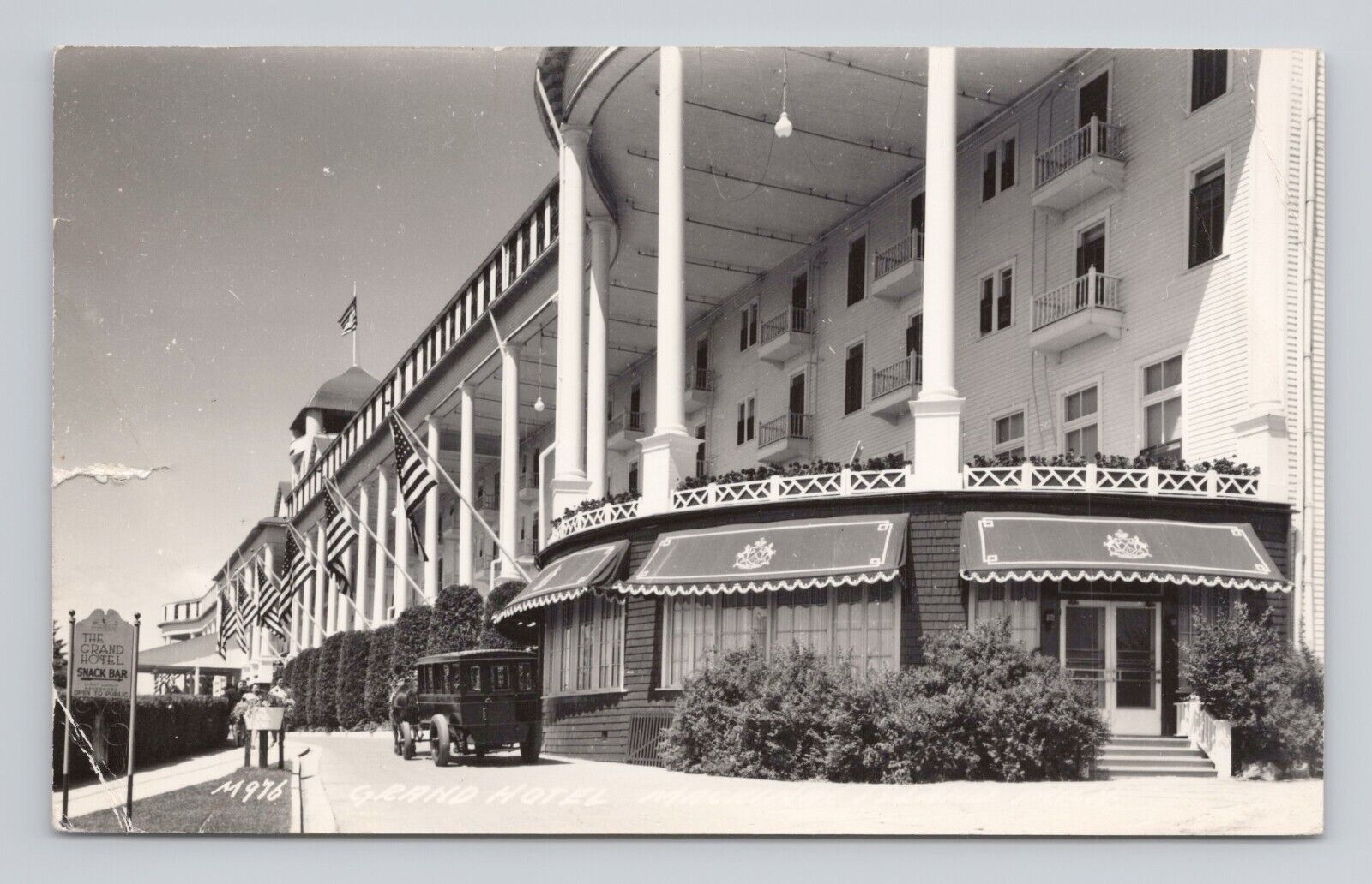 Postcard RPPC Grand Hotel Mackinaw City Michigan Horse Drawn Bus Flags 1948