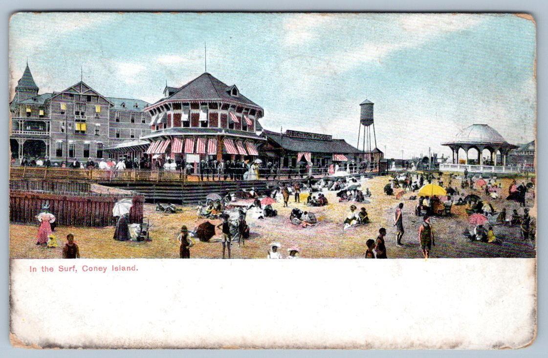 1909 CONEY ISLAND IN THE SURF RED WHITE STRIPE AWNINGS PEOPLE ON BEACH POSTCARD