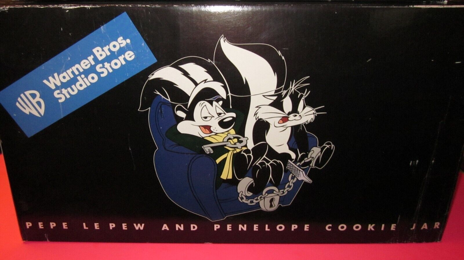 Warner Bros Looney Tunes Pepe Le Pew and Penelope Lock and Key Couch Cookie Jar