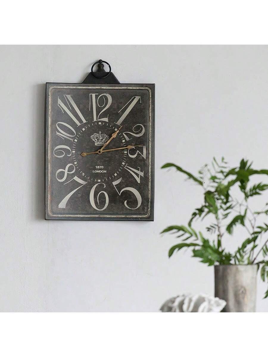 Large vintage black rectangular wall clock with white numbers