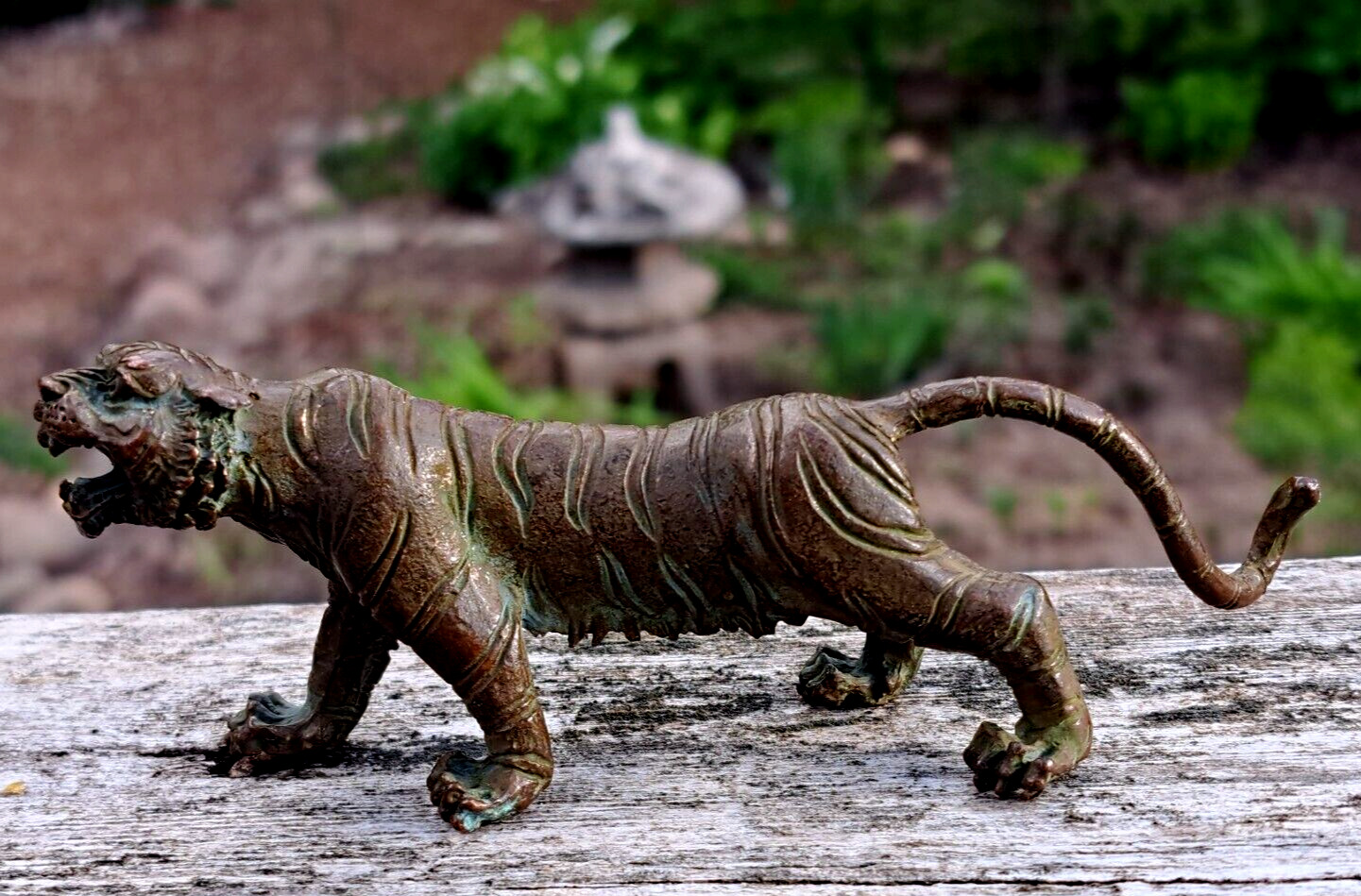 A very fine small antique bronze tiger figurine. Impressed detail.Chinese