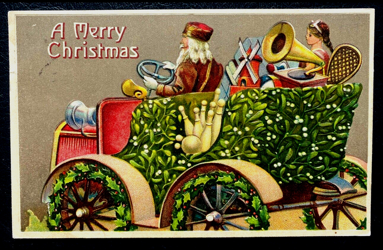 Red  Robe Santa Claus in Old Car with Holly~Toys~Antique~Christmas Postcard~k305