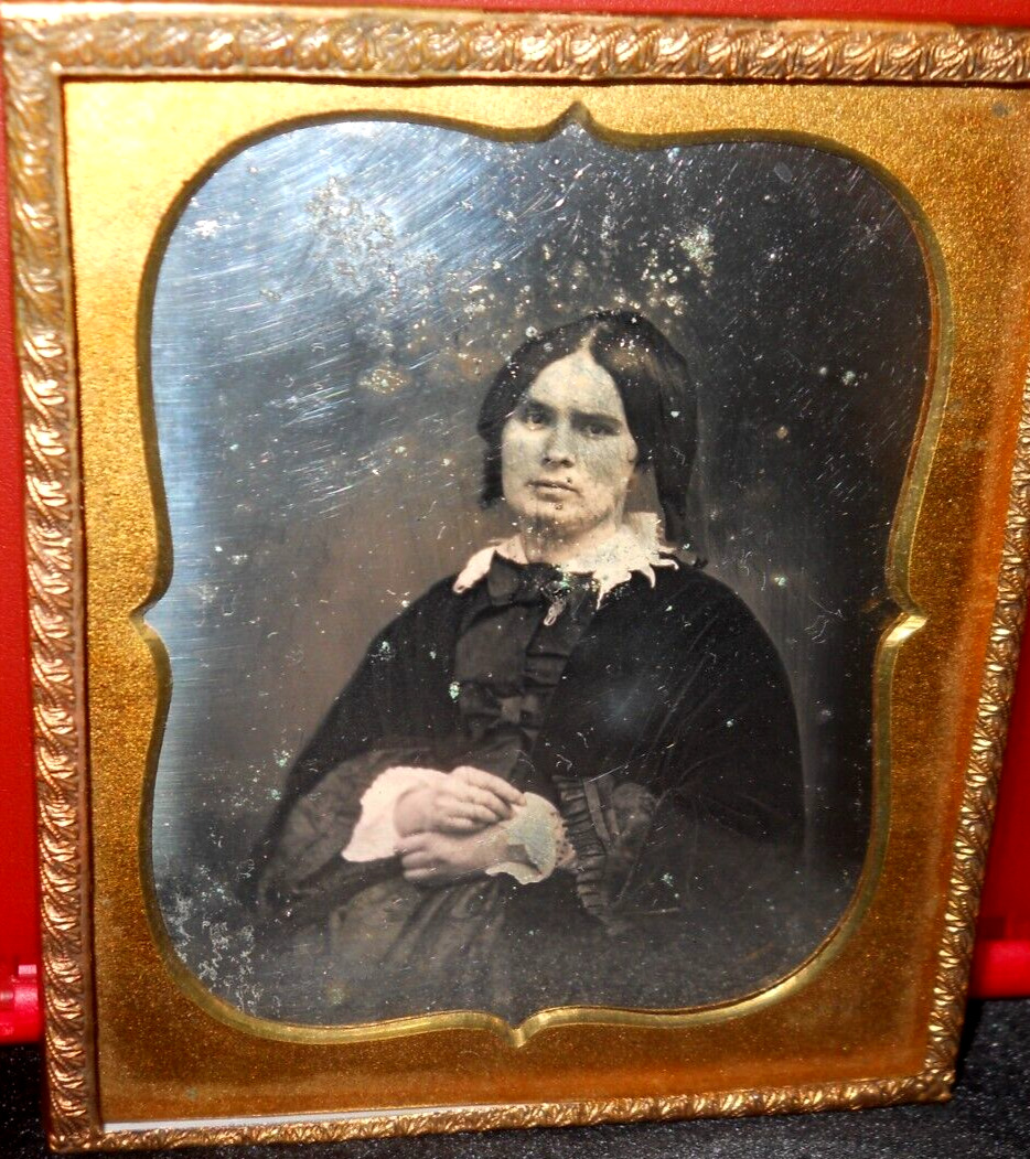 1/6th size Daguerreotype of younger lady in brass mat/frame