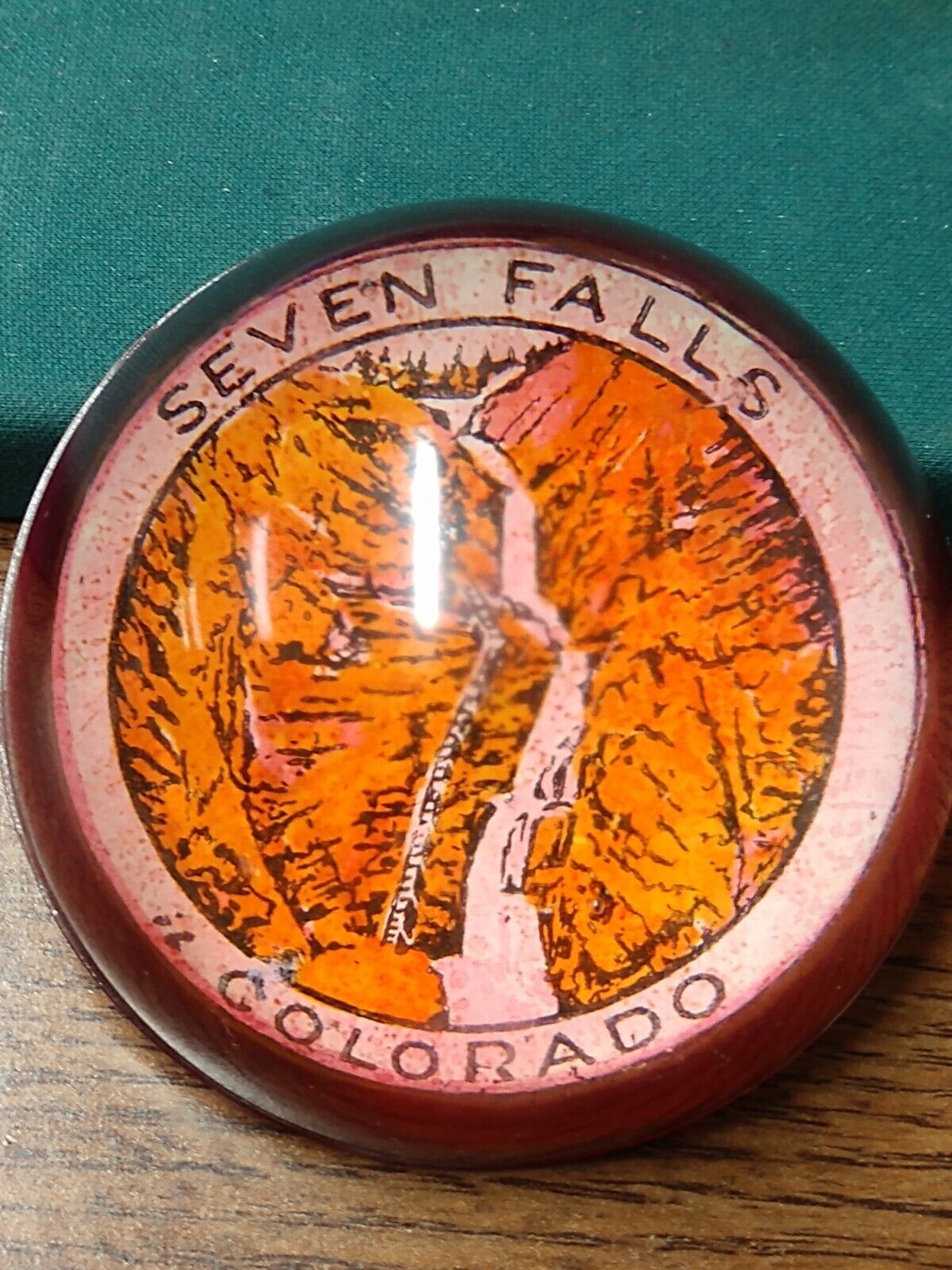 VINTAGE EARLY SEVEN FALLS COLORADO ROUND MAGENTA GLASS PAPER WEIGHT