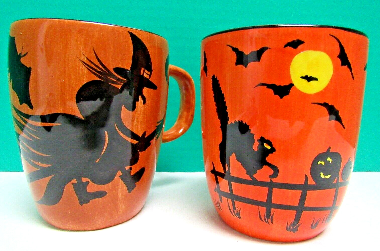 LOT OF 2 HALLOWEEN 12 OZ. CUPS/MUGS FEATURING WITCHES, BLACK CATS, & BATS