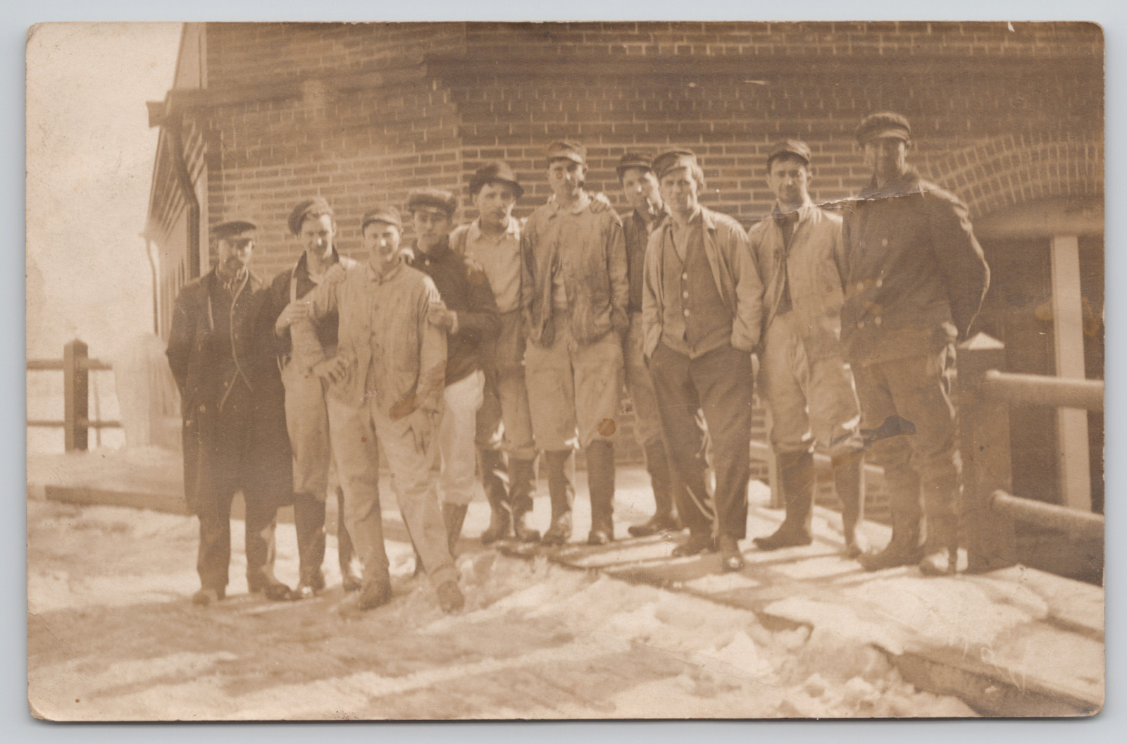 RPPC Men standing on Bridge in the Snow c1905 Real Photo Postcard