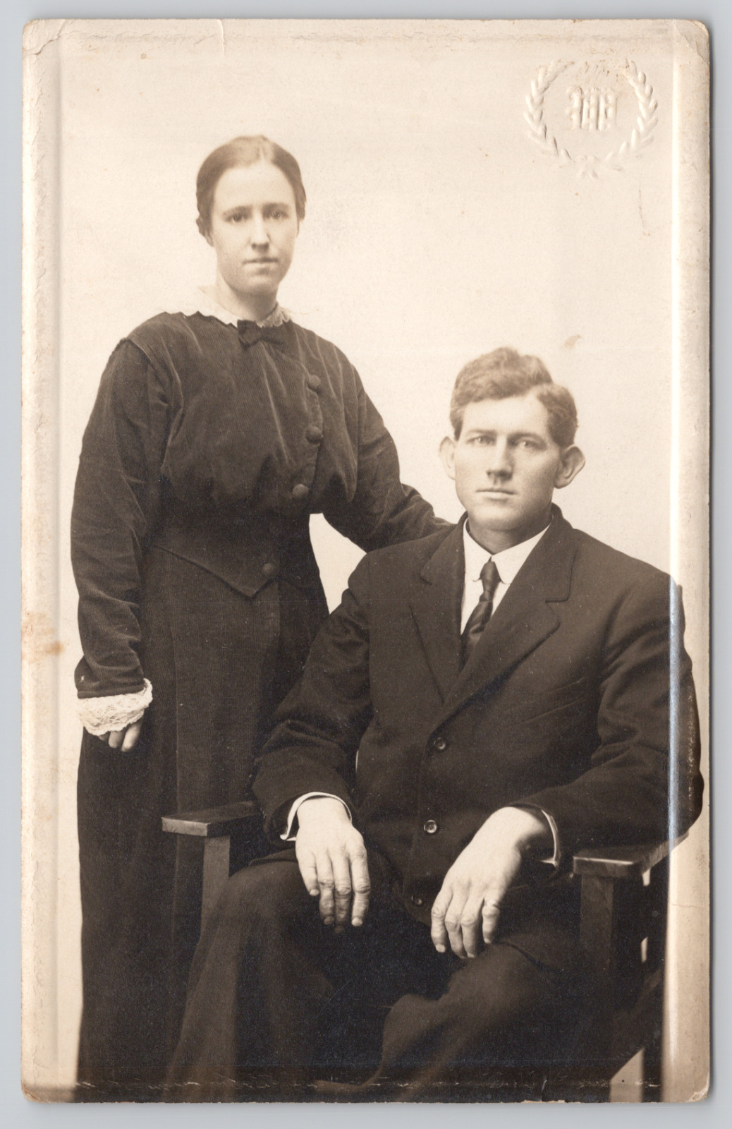 RPPC Man and Women Wearing Black Studio Portrait c1910 Real Photo Postcard