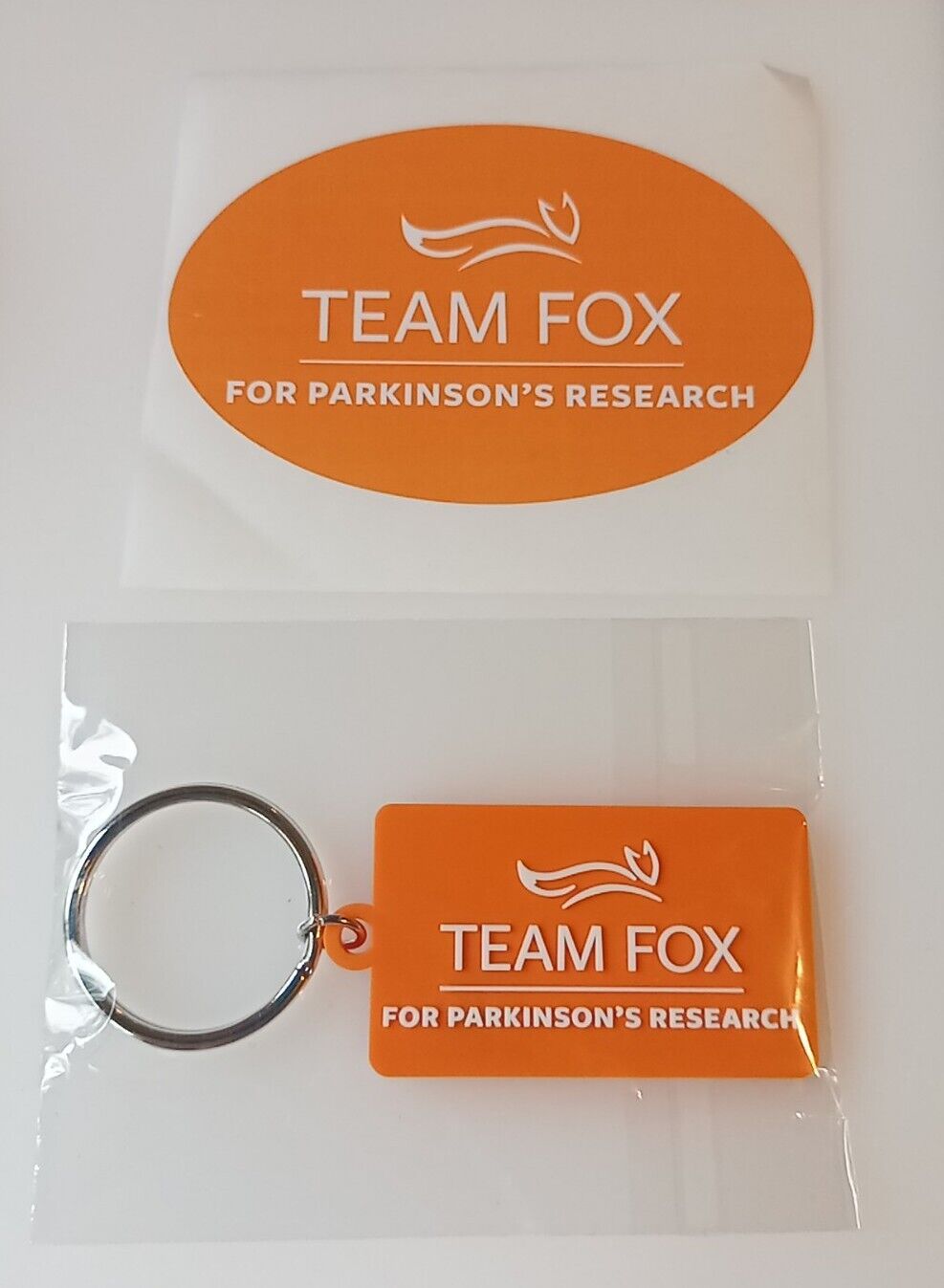 Team Fox Parkinson's Disease Research Orange Rubber Key Chain & Sticker