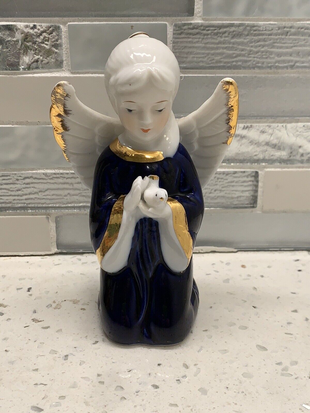 VTG Blue Gold White Porcelain Angel Holding a Dove Figurine Wings Trimmed Gold