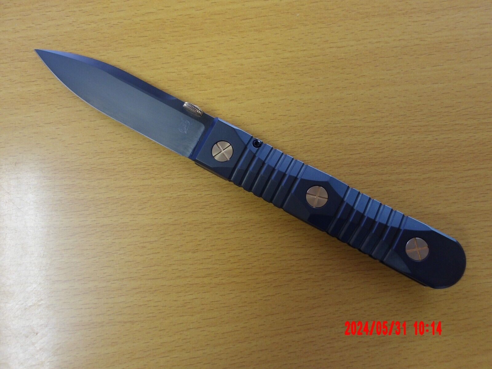 Les George Ek folding knife M390 steel titanium one piece handle.