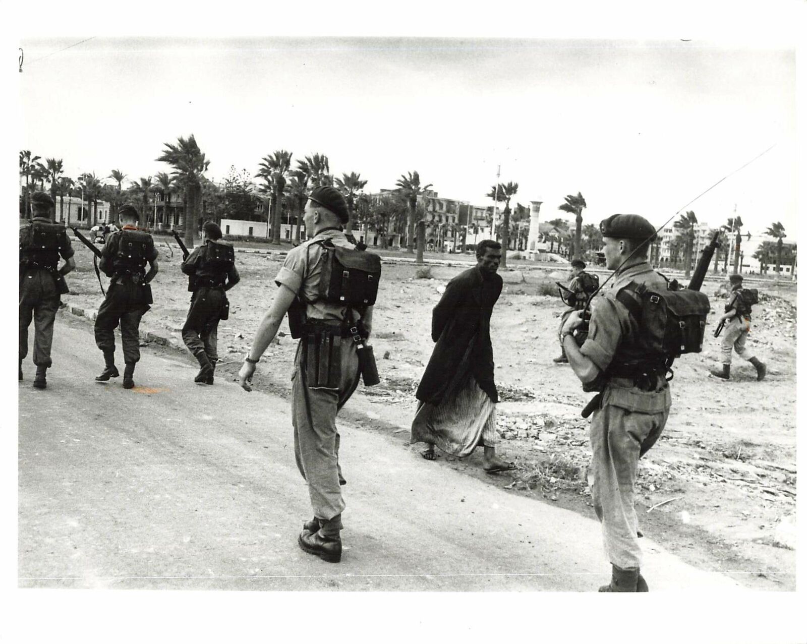 1956 Press Photo Port Said Canal Zone War Soldiers Combat bombs Joseph McKeown