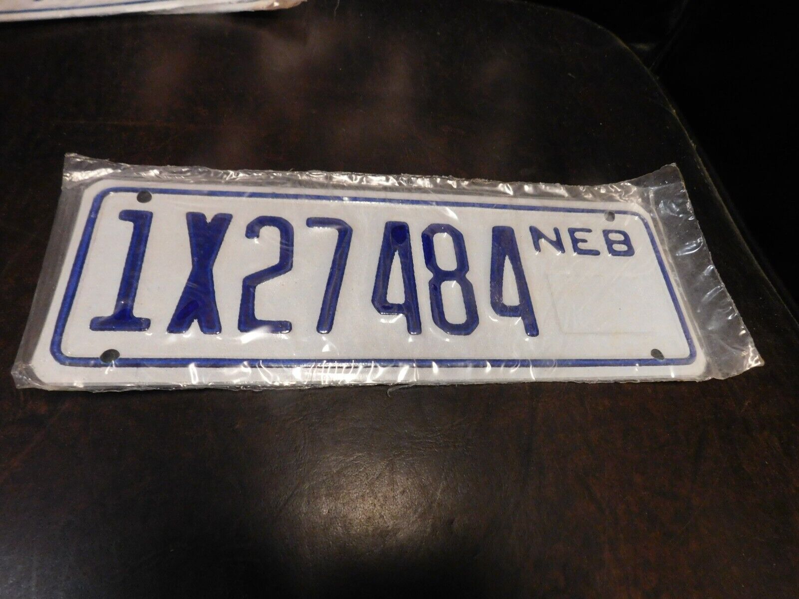 Nebraska Trailer License Plate NE Cancelled in 1996 TAG # 1X27484 - Sealed