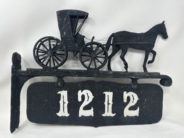 Vintage horse and buggy with driver address sign.