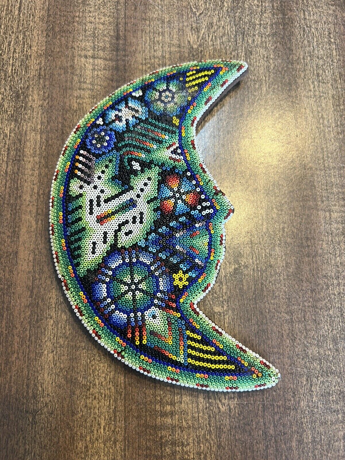 An Unusual and Attractive Huichol Beaded Moon Wall Plaque 8.75”