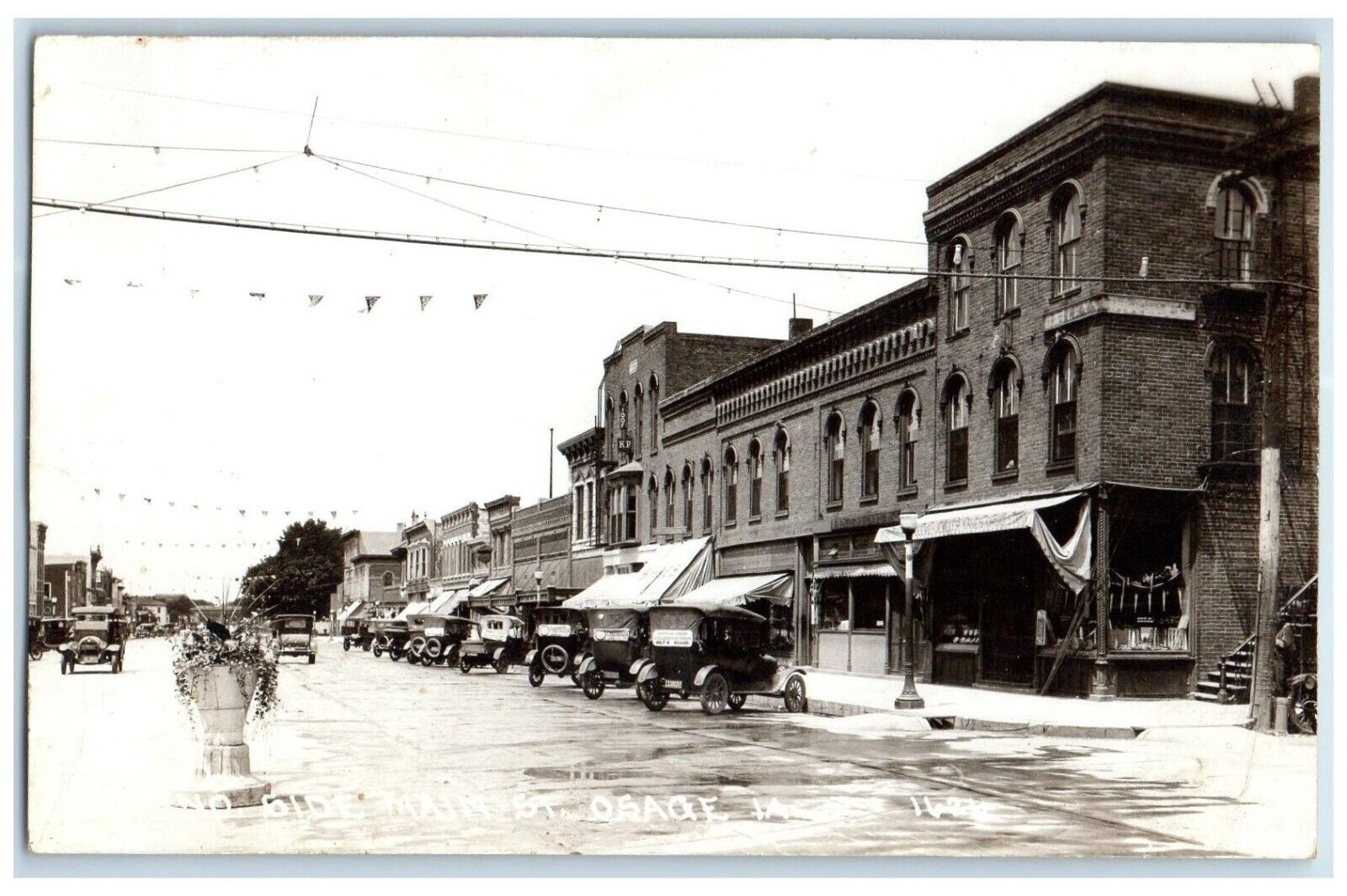 c1910's Main Street View Cars Stores Osage Iowa IA RPPC Photo Antique Postcard