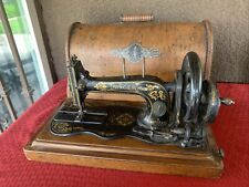 Antique Singer hand crank sewing machine picture