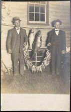 FISHING REAL PHOTO POSTCARD RPPC 2 MEN HOLD LINE OF FISH & 2 LARGE FISH AT NIGHT picture
