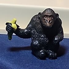 Baby Gorilla Figure Sitting Eating Banana picture