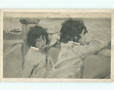Pre-Linen foreign TWO KIDS FROM LATVIA LOOKING OUT AT THE OCEAN 60k cards J3478 picture