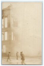 1909 Disaster Fire Firemen Smoke Building Manistee MI RPPC Photo Postcard picture