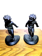 Pair of Bronze Cast Iron Cherub Boy Child Bookends they are about 7/1/2 tall picture