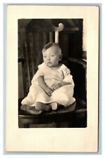 Vintage 1920's RPPC Postcard - Adorable Child on a Wooden Chair picture