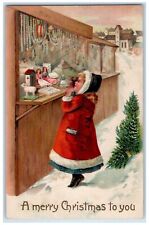c1910's Christmas Girl Santa Costume Doll Store Pine Tree Embossed Postcard picture