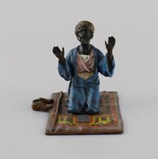 Antique cold-painted Vienna bronze shaped as praying man on a prayer mat. picture