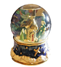 Snow globe music box plays silent night has chapel pine trees ceramic base picture