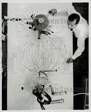 1965 Press Photo Carl H. Rosner Shows Magnetic Fields of Superconducting Magnets picture